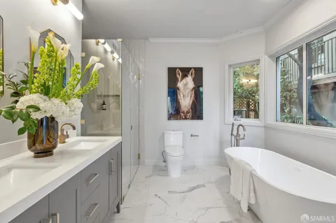 a bathroom with a sink a toilet and a bathtub