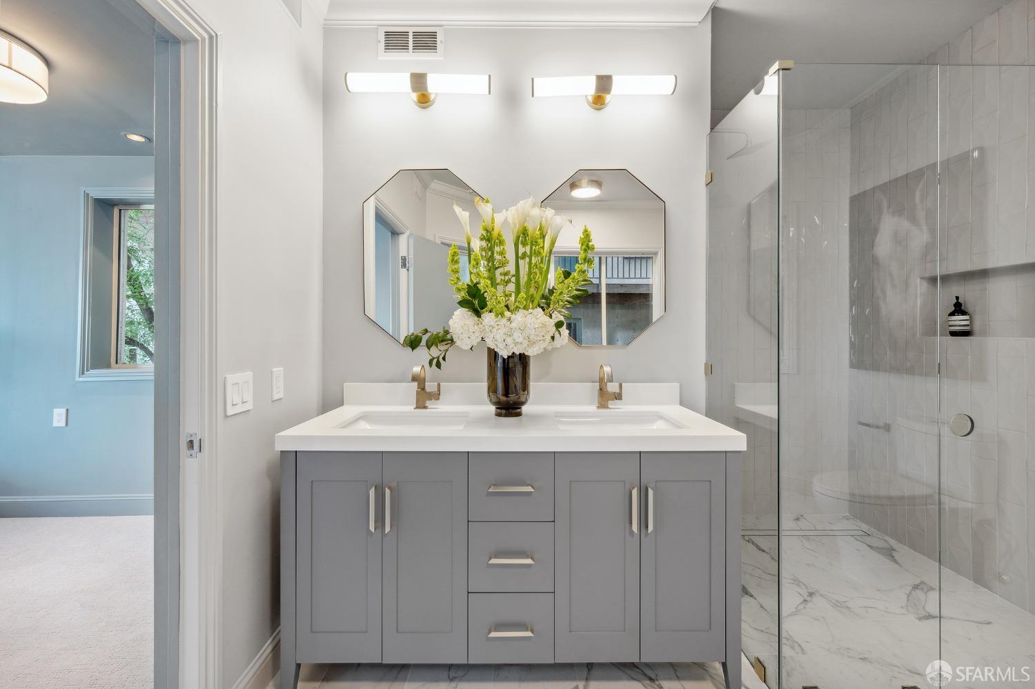 900 Green Street, Unit 600 San Francisco, CA 94133 - Photo 40 of 50 a bathroom with a double vanity sink and a mirror