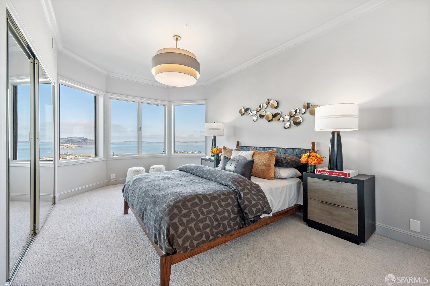 900 Green Street, Unit 600 San Francisco, CA 94133 - Photo 41 of 50 a bedroom with a bed and a chandelier