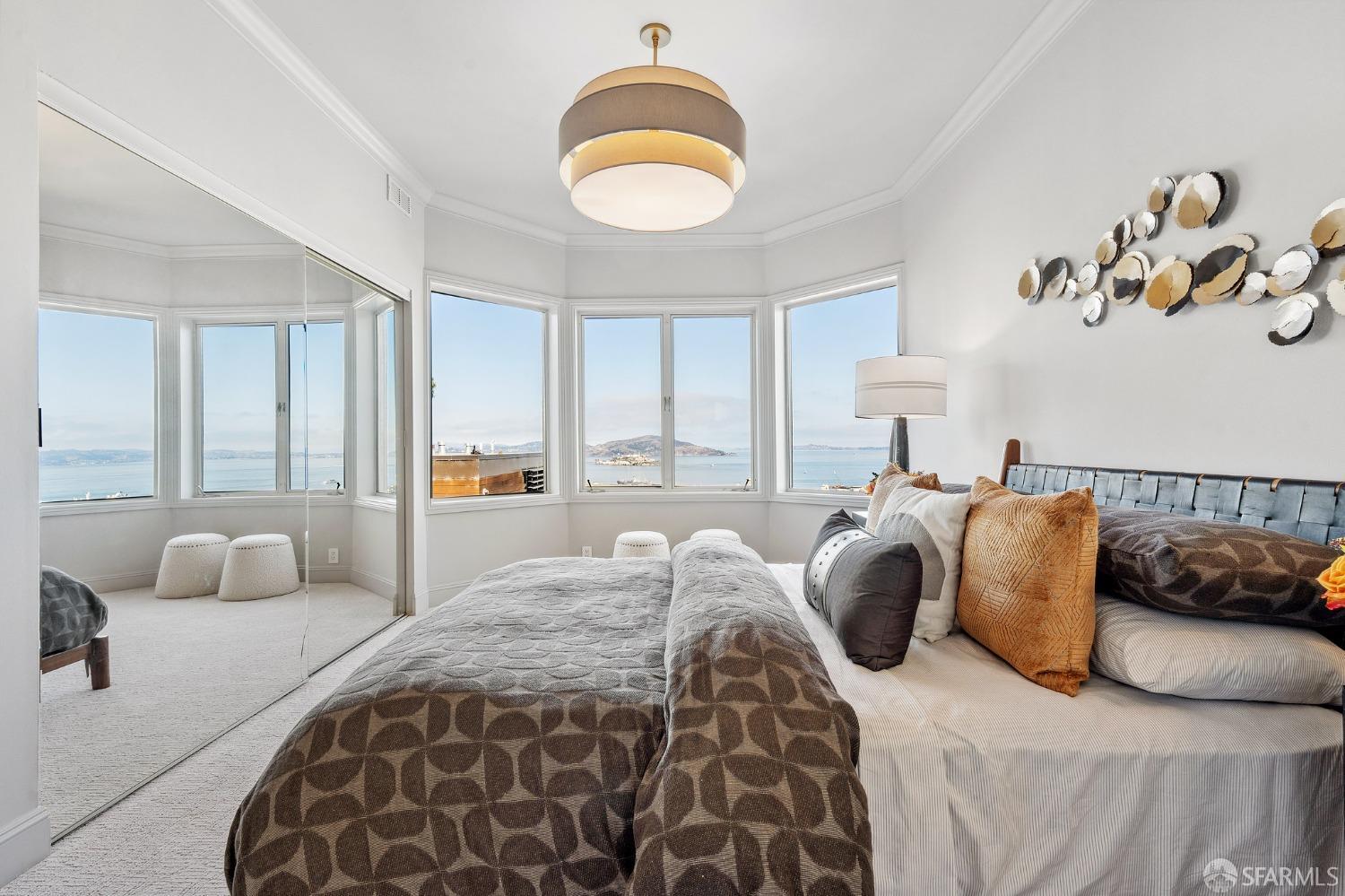 900 Green Street, Unit 600 San Francisco, CA 94133 - Photo 42 of 50 a bedroom with a bed and a painting on the wall