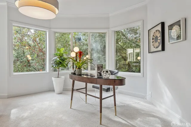 a workspace with furniture and a window