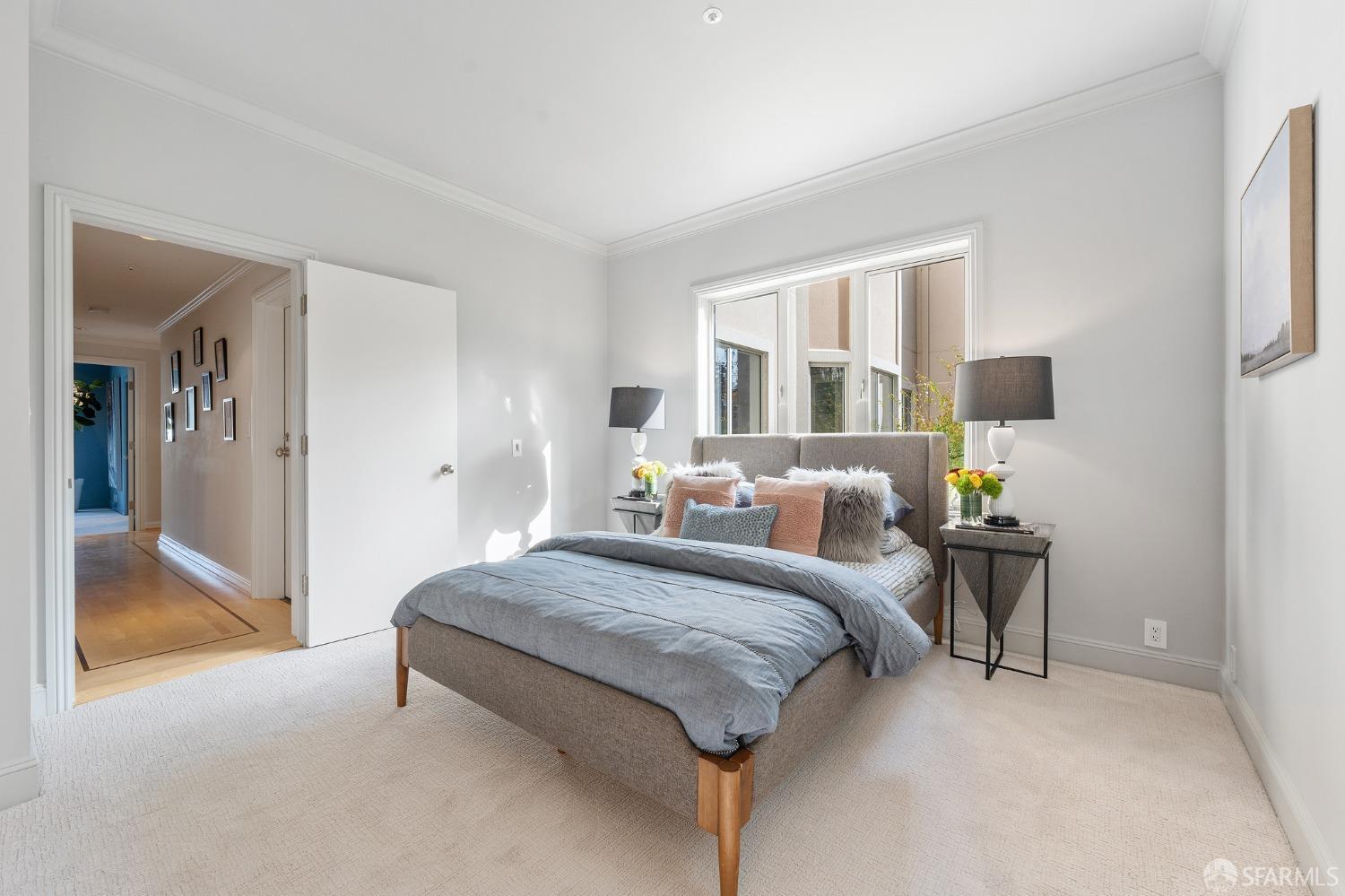 900 Green Street, Unit 600 San Francisco, CA 94133 - Photo 46 of 50 a spacious bedroom with a bed and large mirror