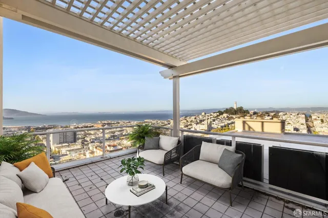 a outdoor living space with furniture and city view