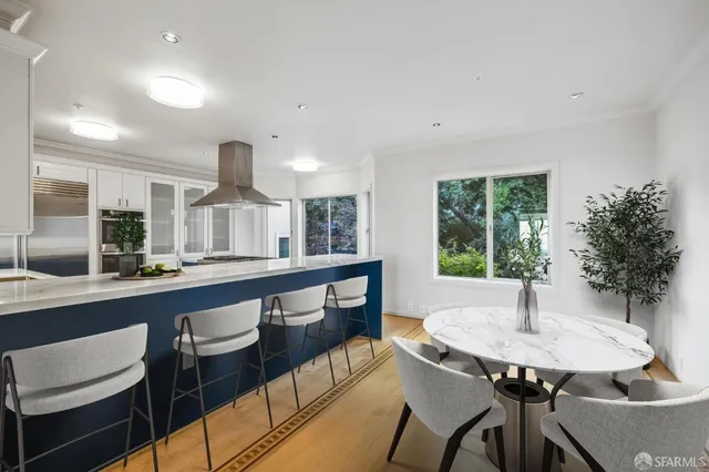 a kitchen with a table and chairs in it