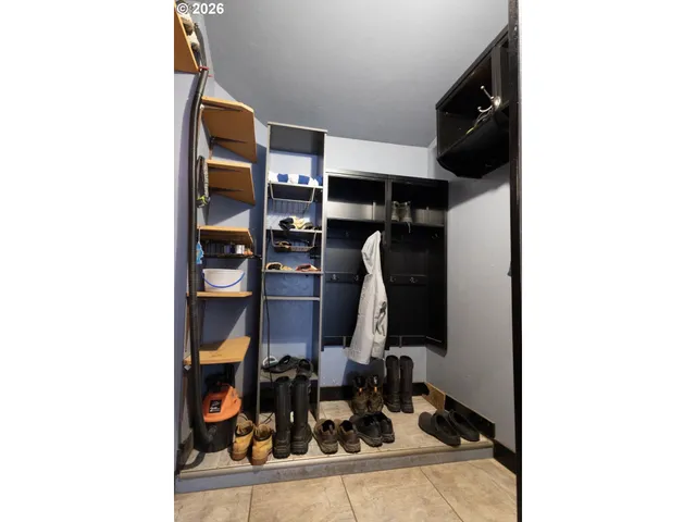a view of a living room with a air conditioner and a window