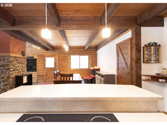 a view of a living room with a large window