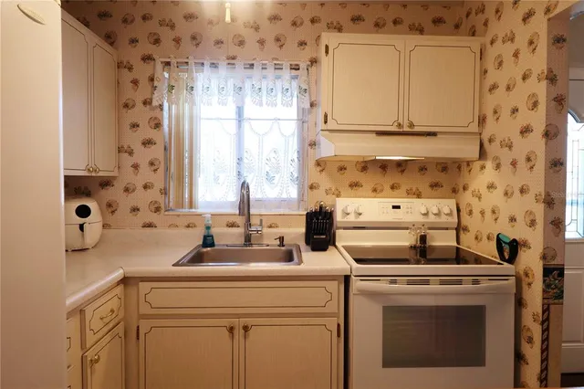 a view of washer and dryer with kitchen appliances