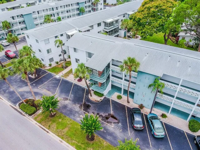 an aerial view of a chairs and table in patio
