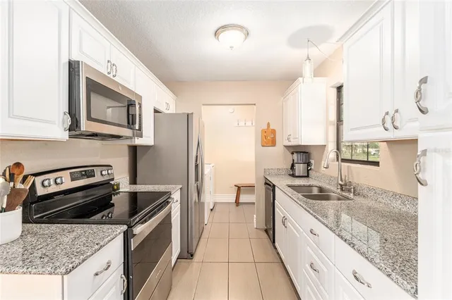 a kitchen with a stove and a microwave