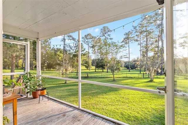 a view of a sitting area with chairs in balcony