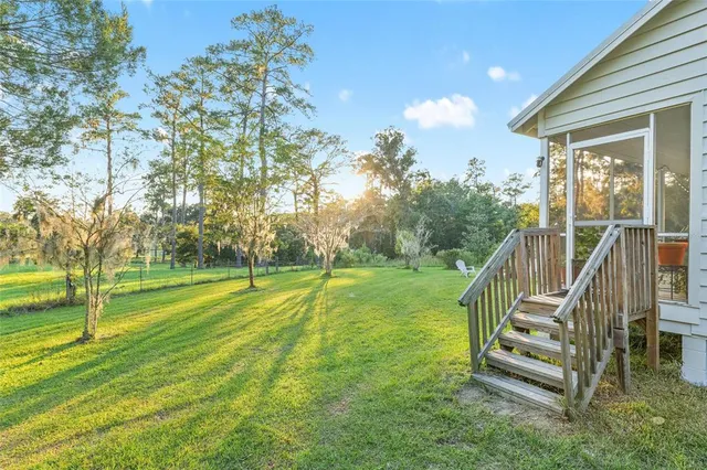 a view of a table and chairs in the garden