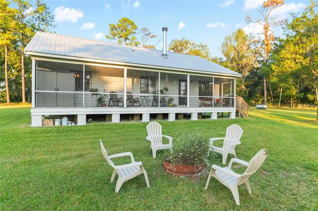 a view of a park with large trees