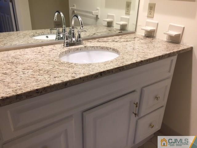 5001 Stonehedge Road, Unit 5001 Edison, NJ 08820 - Photo 11 of 13 a close view of sink and tap