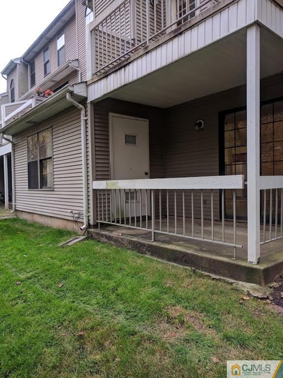 5001 Stonehedge Road, Unit 5001 Edison, NJ 08820 - Photo 8 of 13 a view of a house with backyard and deck