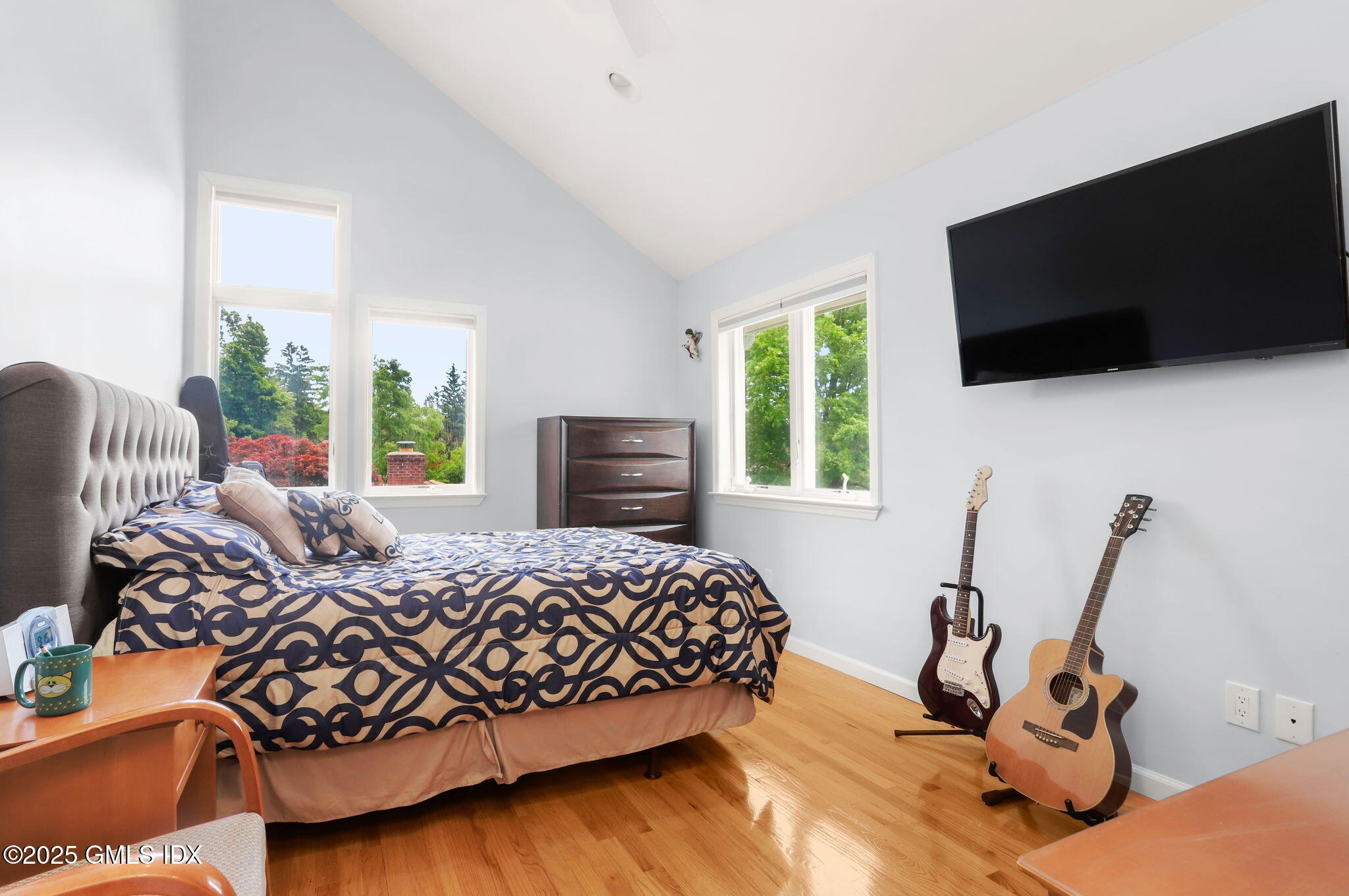 16 Elizabeth Lane Riverside, CT 06878 - Photo 27 of 38 a bedroom with a bed and a flat screen tv