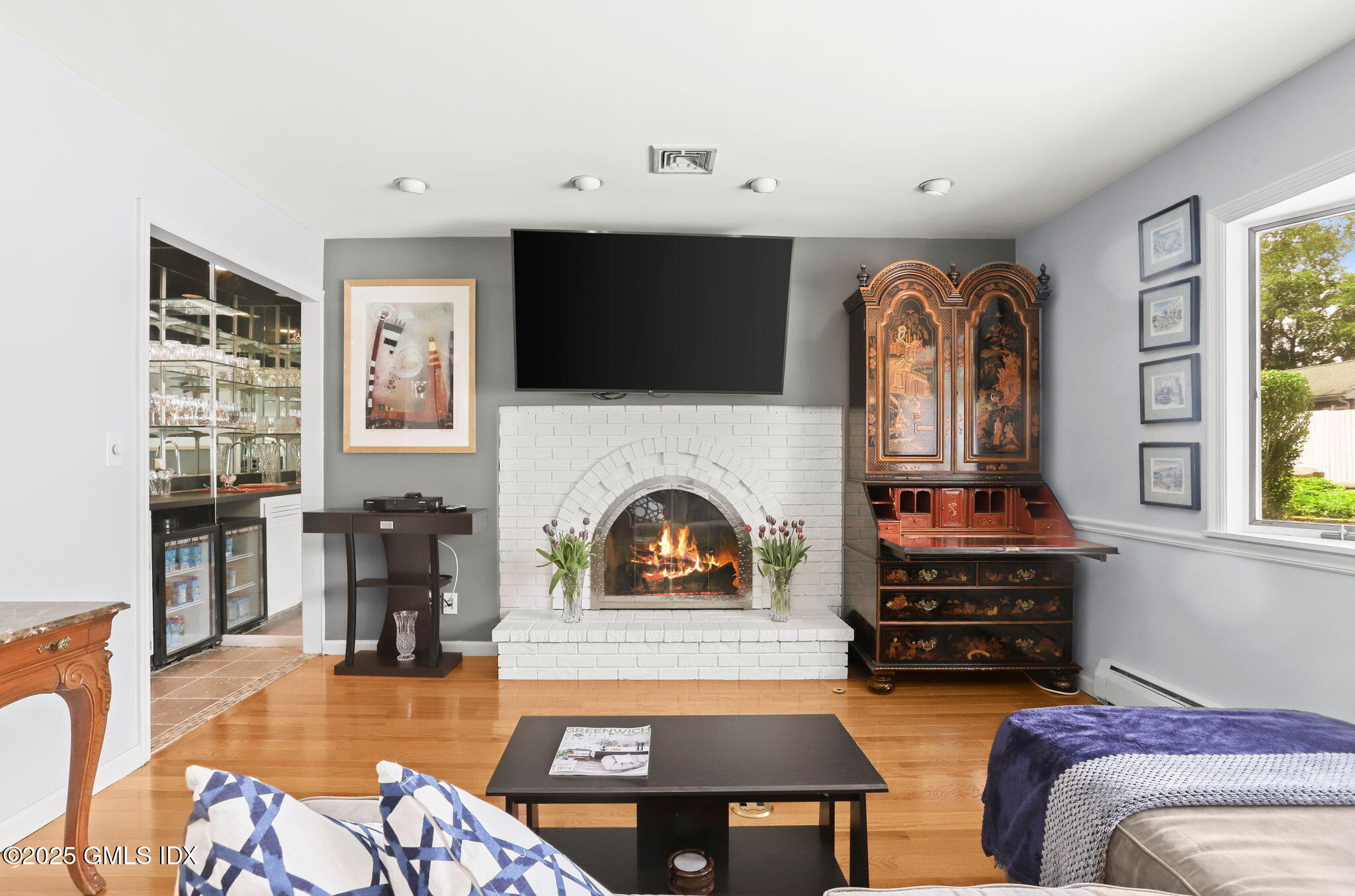 16 Elizabeth Lane Riverside, CT 06878 - Photo 3 of 38 a living room with furniture fireplace and flat screen tv