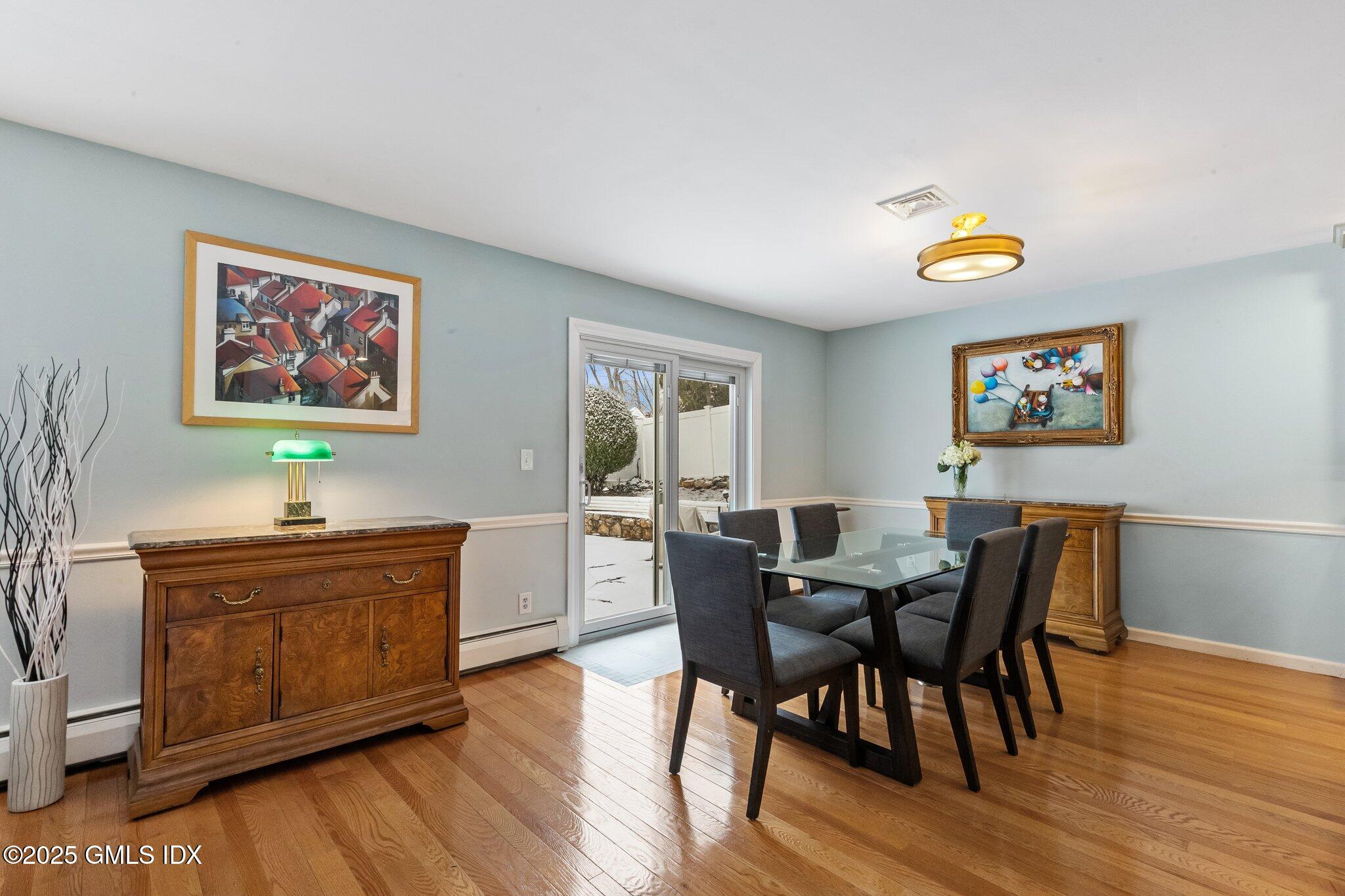 16 Elizabeth Lane Riverside, CT 06878 - Photo 8 of 38 a view of a dining room with furniture and wooden floor