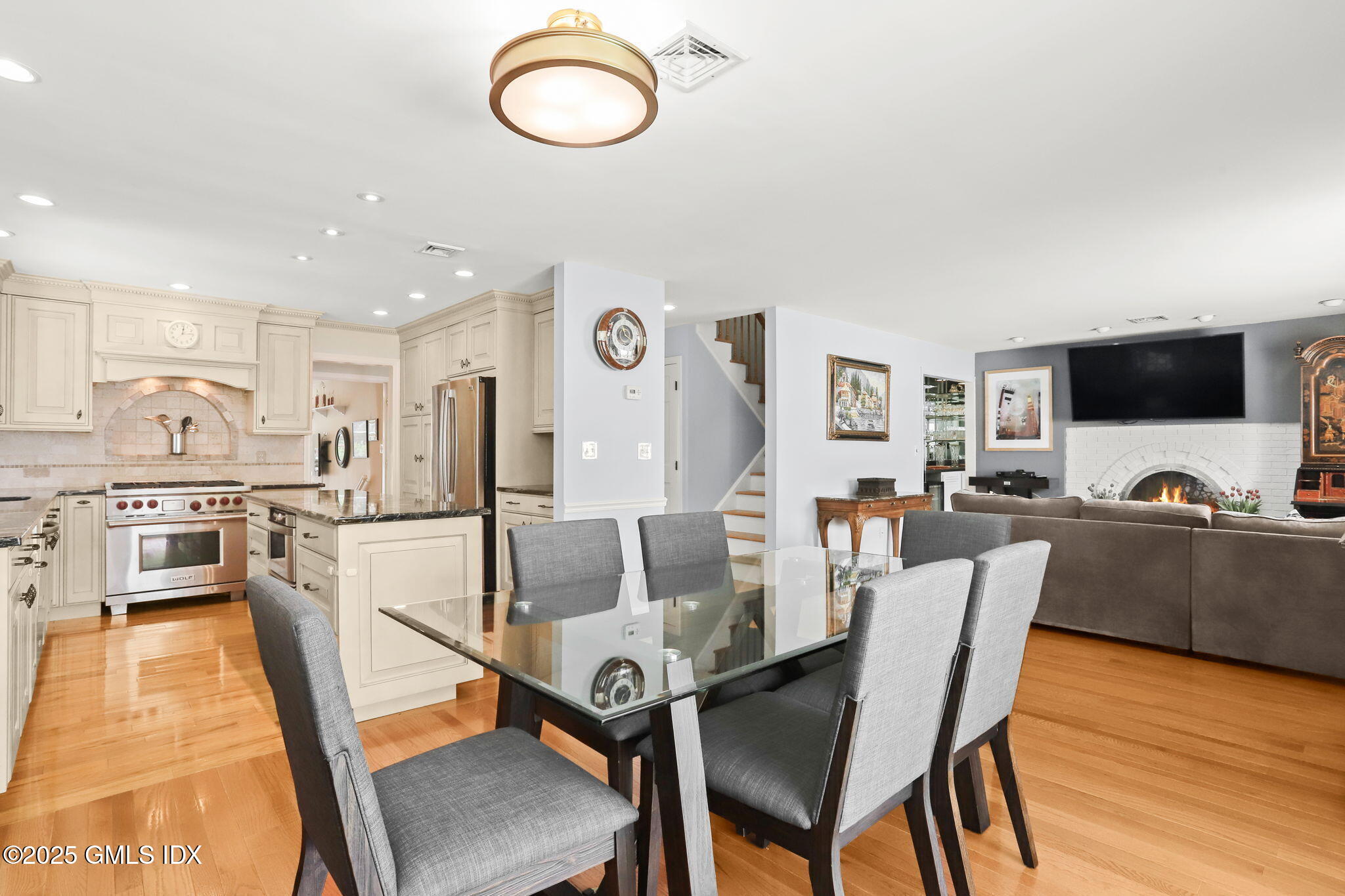 16 Elizabeth Lane Riverside, CT 06878 - Photo 9 of 38 a view of a dining room with furniture and a kitchen
