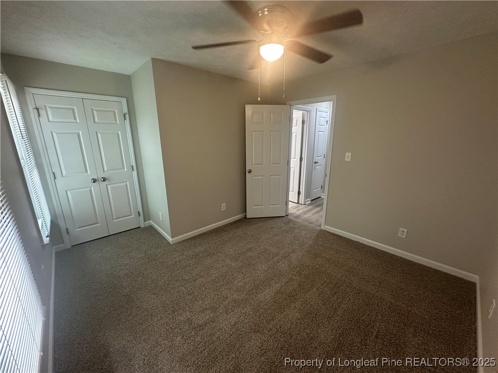 75 Tradewinds Drive Spring Lake, NC 28390 - Photo 11 of 26 an empty room with windows and fan