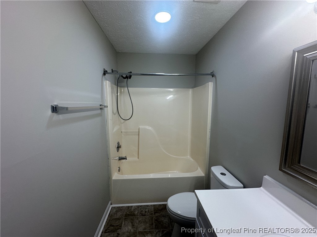 75 Tradewinds Drive Spring Lake, NC 28390 - Photo 13 of 26 a bathroom with a sink toilet and shower