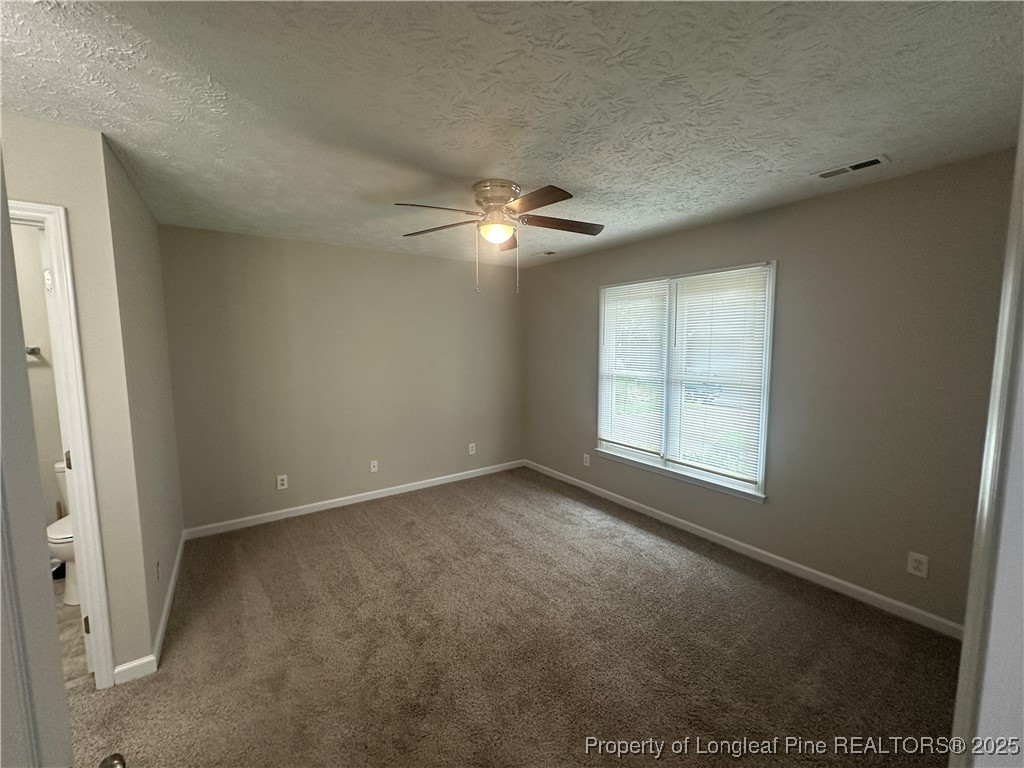 75 Tradewinds Drive Spring Lake, NC 28390 - Photo 15 of 26 an empty room with windows and fan