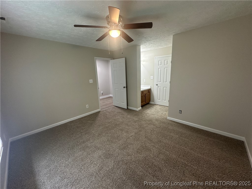 75 Tradewinds Drive Spring Lake, NC 28390 - Photo 16 of 26 an empty room with a ceiling fan and a window