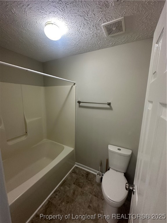 75 Tradewinds Drive Spring Lake, NC 28390 - Photo 18 of 26 a white toilet sitting next to a bath tub