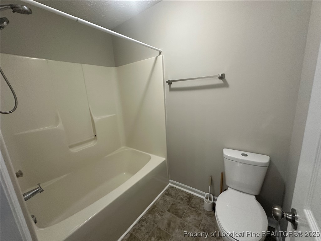 75 Tradewinds Drive Spring Lake, NC 28390 - Photo 19 of 26 a bathroom with a toilet and a shower