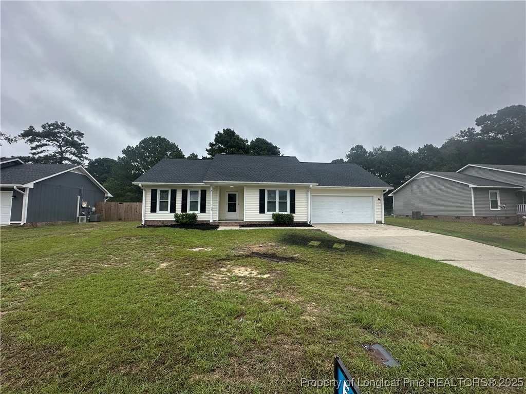 75 Tradewinds Drive Spring Lake, NC 28390 - Photo 2 of 26 a front view of a house with garden