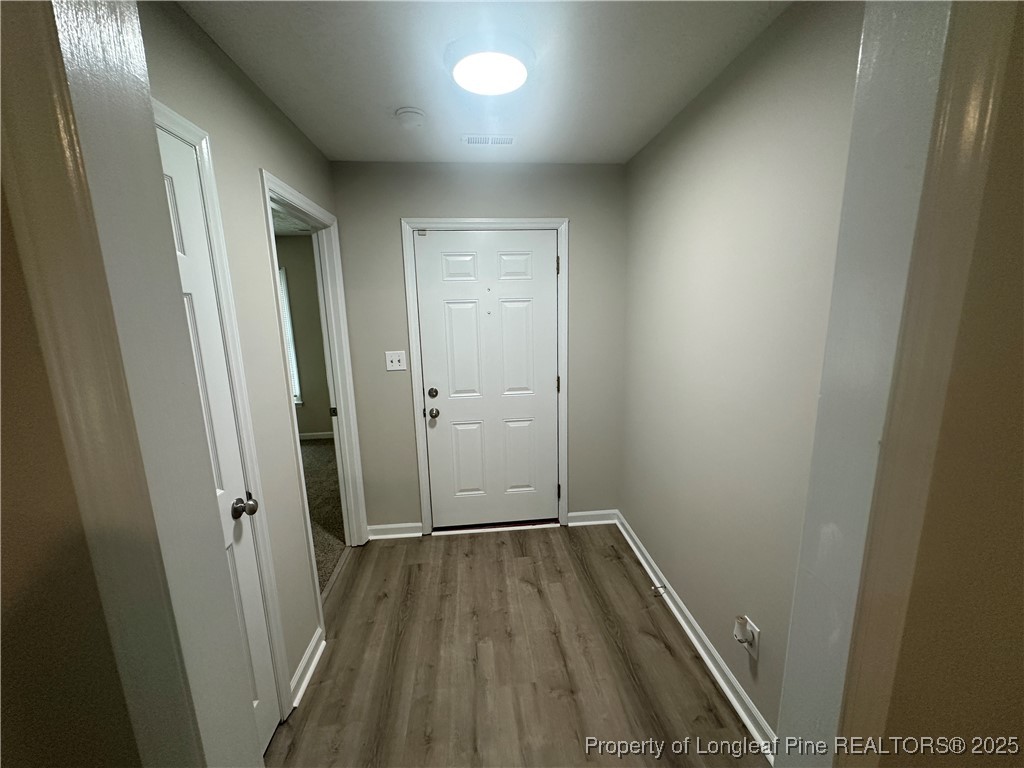 75 Tradewinds Drive Spring Lake, NC 28390 - Photo 3 of 26 a view of a hallway with wooden floor