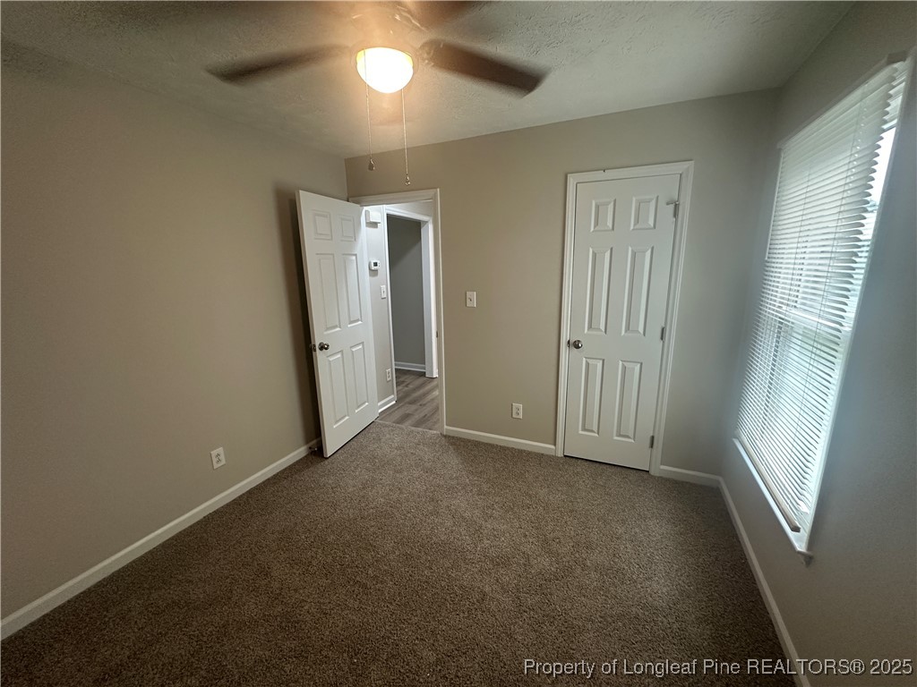 75 Tradewinds Drive Spring Lake, NC 28390 - Photo 9 of 26 an empty room with windows and entrance