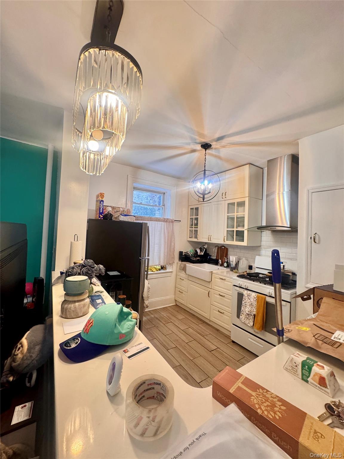98-15 34th Avenue Queens, NY 11368 - Photo 37 of 41 a kitchen with a sink stainless steel appliances furniture and a window