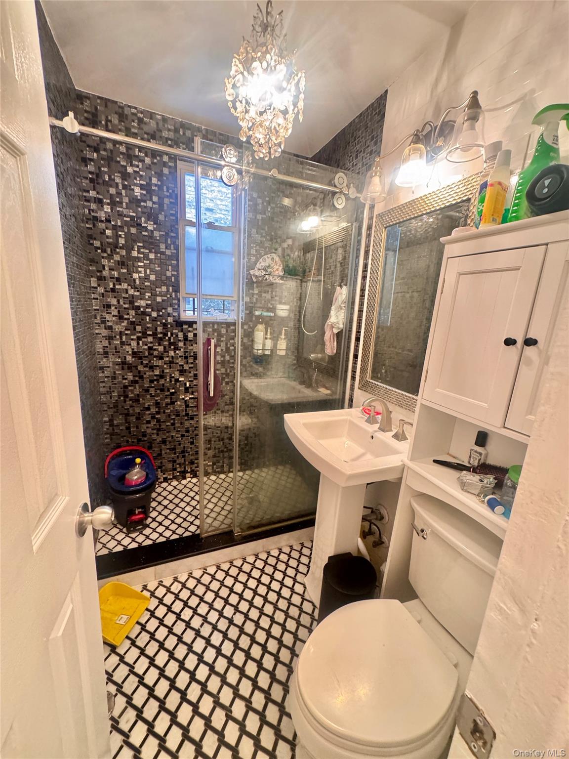 98-15 34th Avenue Queens, NY 11368 - Photo 38 of 41 a bathroom with a sink a toilet and shower