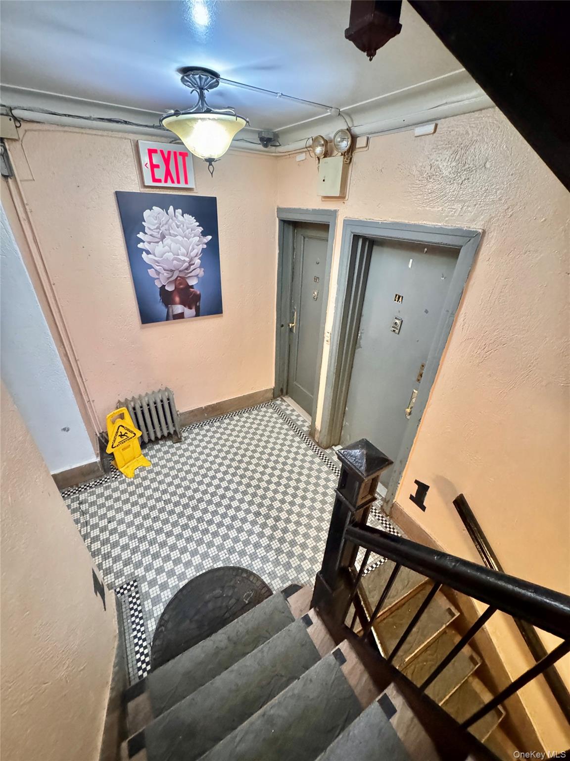 98-15 34th Avenue Queens, NY 11368 - Photo 5 of 41 a bedroom with a bed and wooden floor