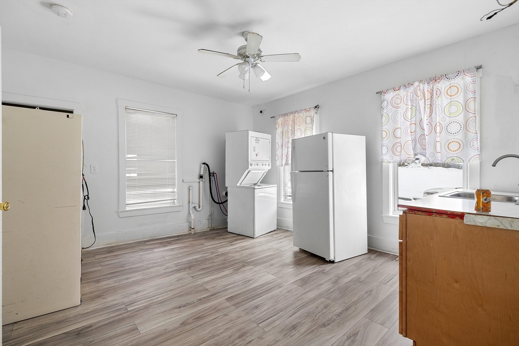 1 Ely Street Worcester, MA 01610 - Photo 11 of 25 a kitchen with stainless steel appliances a refrigerator and a stove top oven