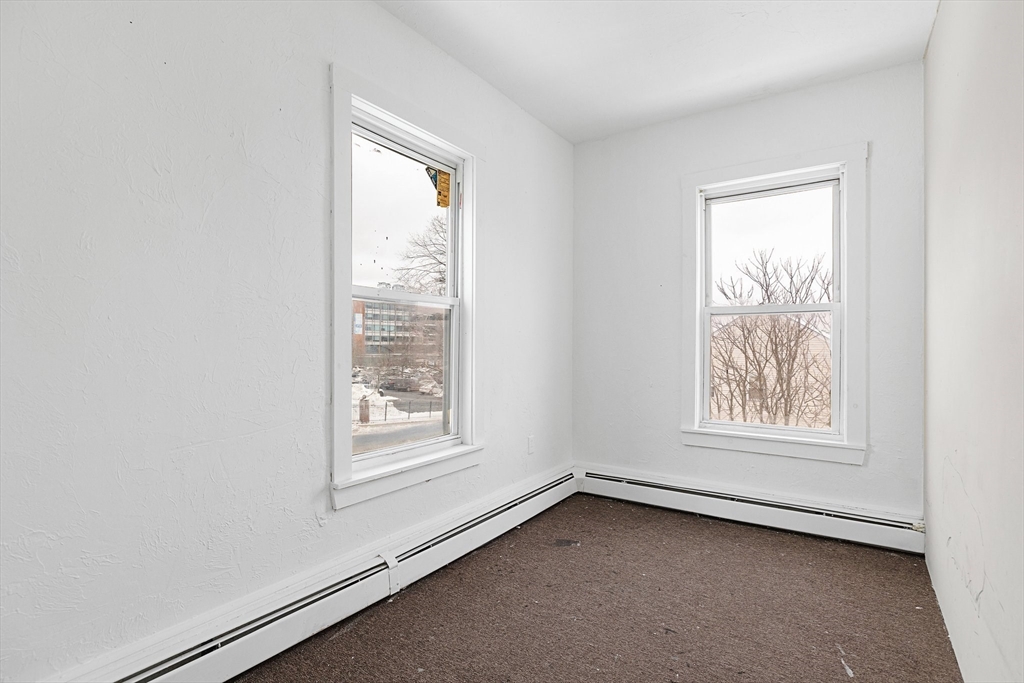 1 Ely Street Worcester, MA 01610 - Photo 14 of 25 an empty room with a window