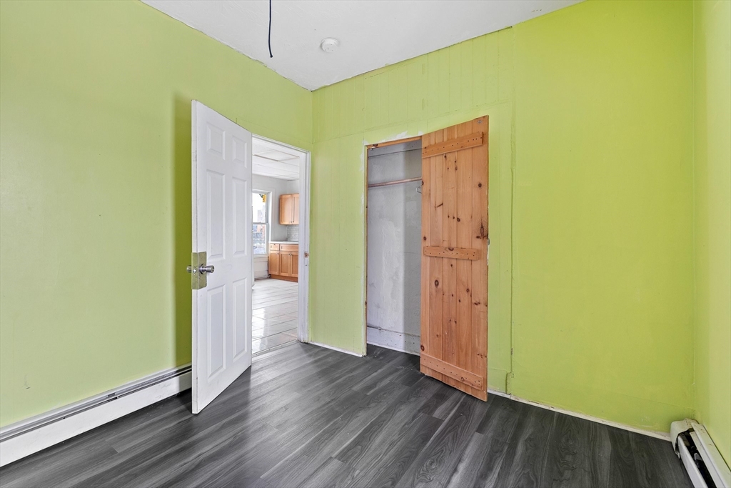 1 Ely Street Worcester, MA 01610 - Photo 16 of 25 a view of a hallway with wooden floor