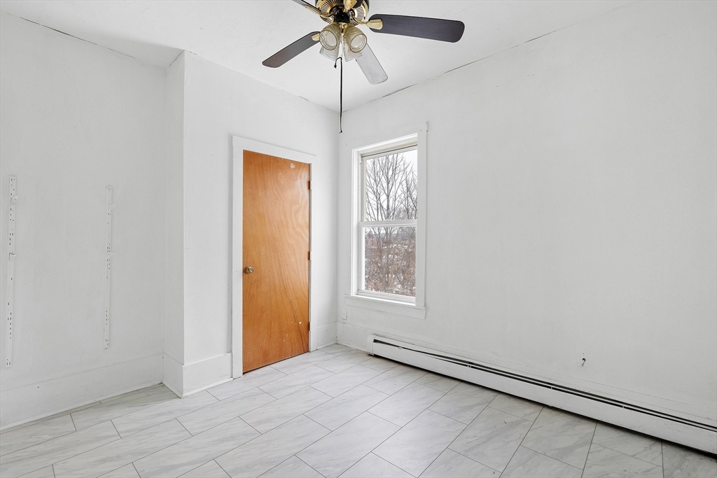 1 Ely Street Worcester, MA 01610 - Photo 19 of 25 a view of an empty room with a window