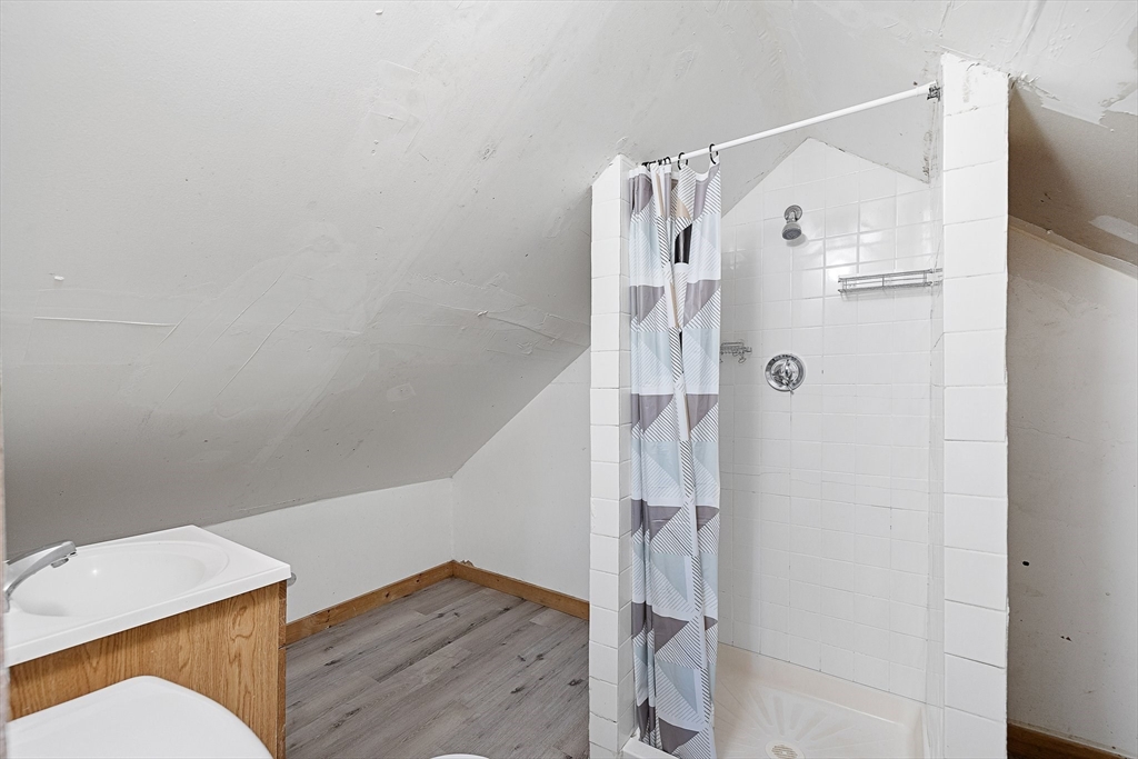 1 Ely Street Worcester, MA 01610 - Photo 22 of 25 a bathroom with a shower and a sink