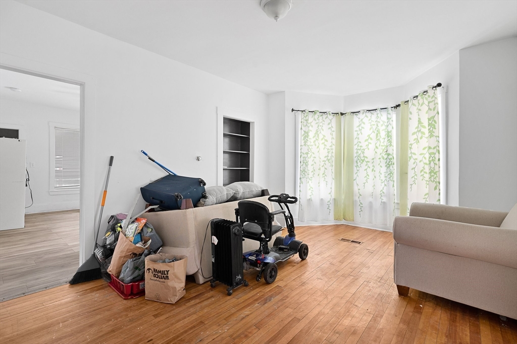 1 Ely Street Worcester, MA 01610 - Photo 9 of 25 a living room with furniture and wooden floor