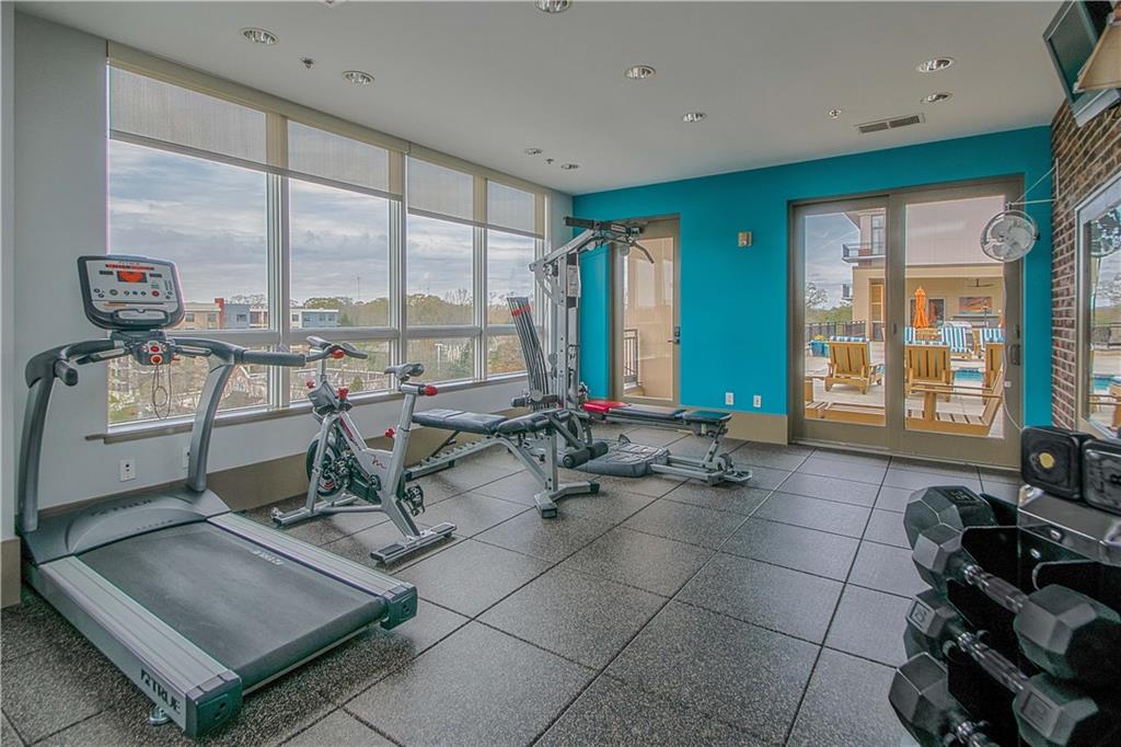201 West Ponce De Leon Avenue, Unit 702 Decatur, GA 30030 - Photo 32 of 41 a room with gym equipment and large windows