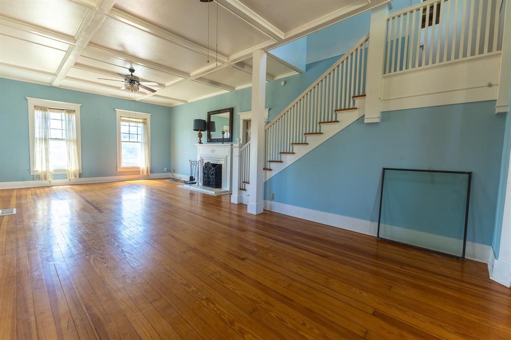 1115 Austin Street Coleman, TX 76834 - Photo 3 of 40 a view of empty room with wooden floor and fan