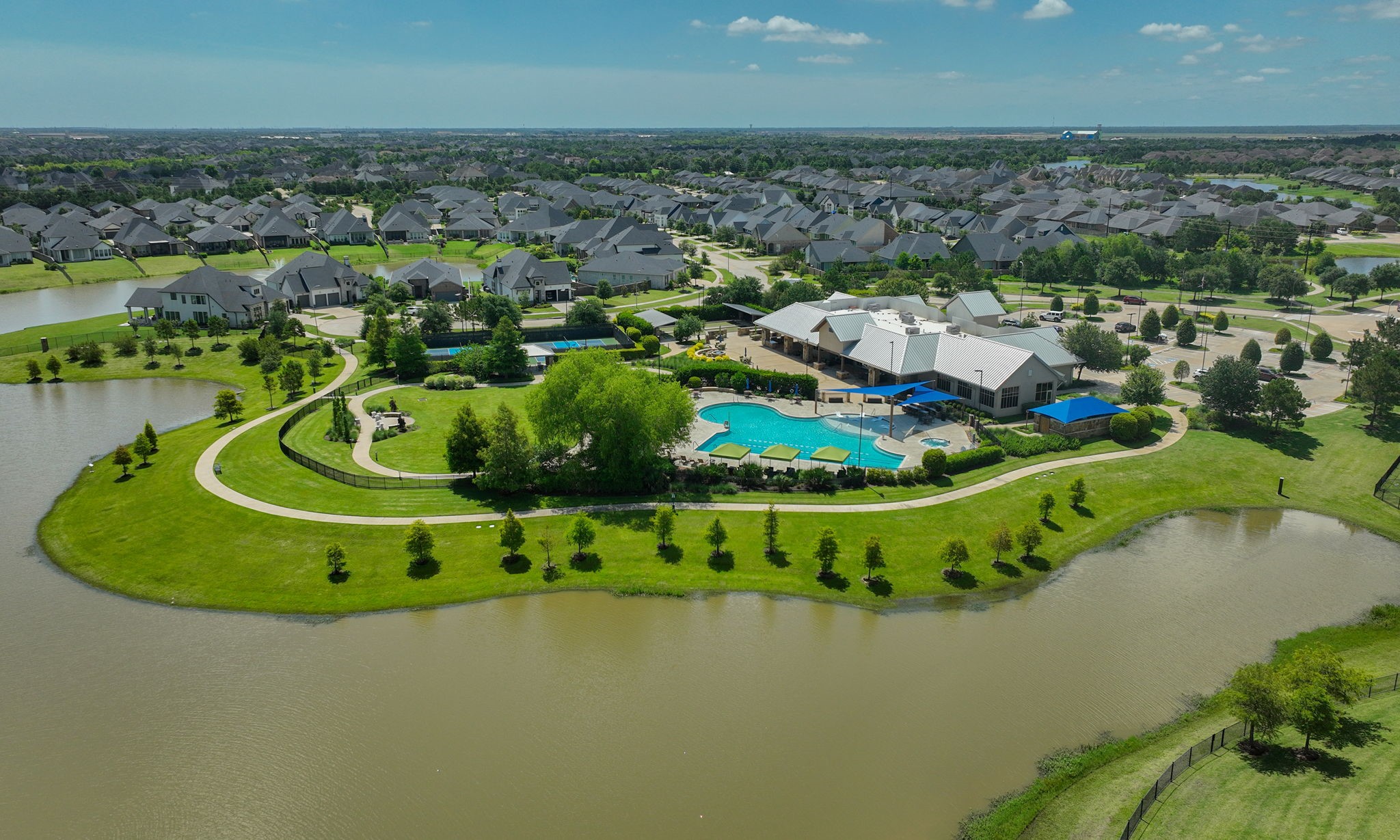 28518 Hoffman Spring Lane Fulshear, TX 77441 - Photo 47 of 50 Greenthread Park has resort-style pool, slides, party pavilion, tennis courts, walking trails and playground on beautiful Heron Lake.
