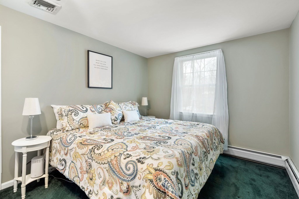 22 Oak Road Littleton, MA 01460 - Photo 17 of 42 a bedroom with a bed and a window