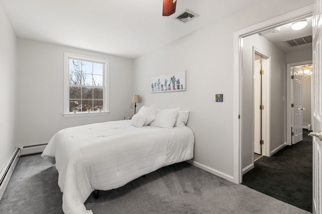 22 Oak Road Littleton, MA 01460 - Photo 21 of 42 a bedroom with a bed and window