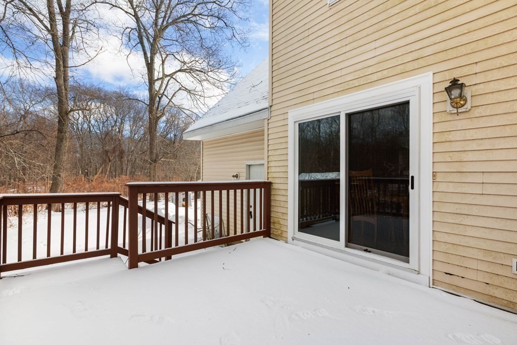 22 Oak Road Littleton, MA 01460 - Photo 29 of 42 a view of a house with a large window and wooden fence