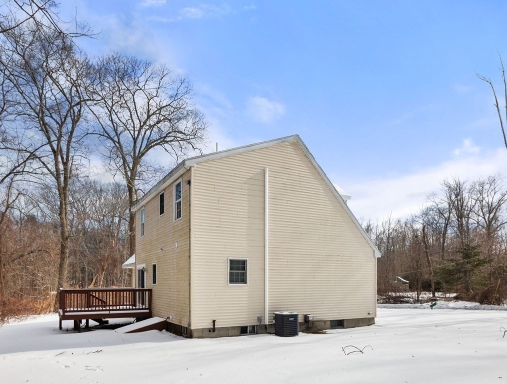 22 Oak Road Littleton, MA 01460 - Photo 31 of 42 a view of a back yard of the house