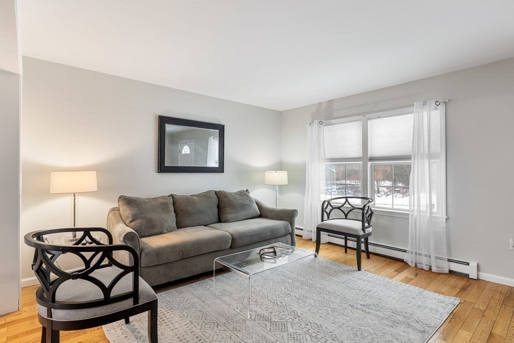 22 Oak Road Littleton, MA 01460 - Photo 4 of 42 a living room with furniture and a window