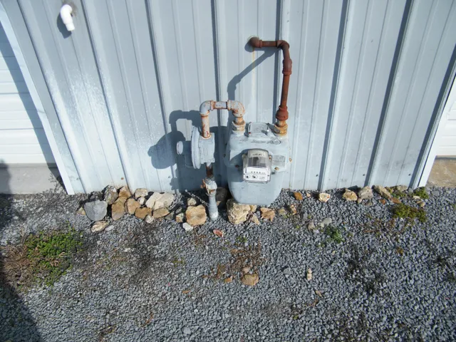 a bathroom with a shower and mirror