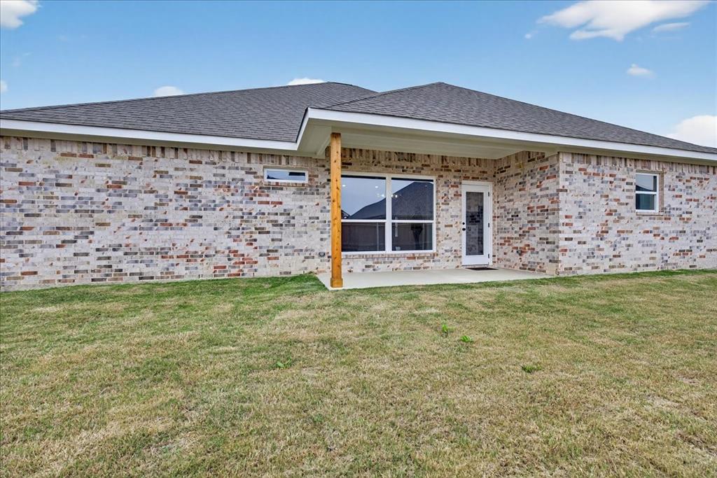 117 East Bexar Street Mabank, TX 75147 - Photo 20 of 27 a front view of a house with a garden
